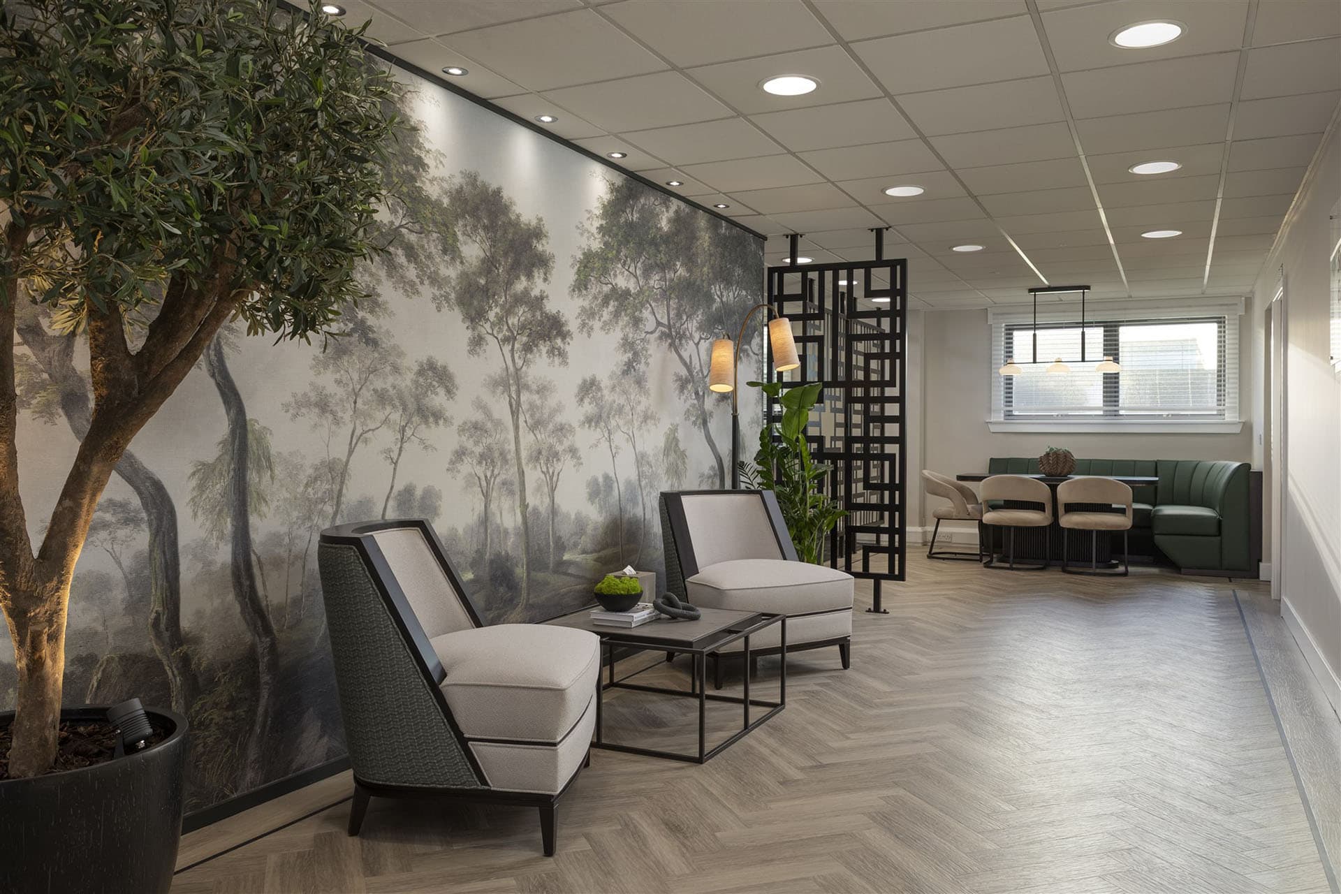 Reception lounge seating area with landscape mural wallpaper at Holborn Workplace office in Aberdeen