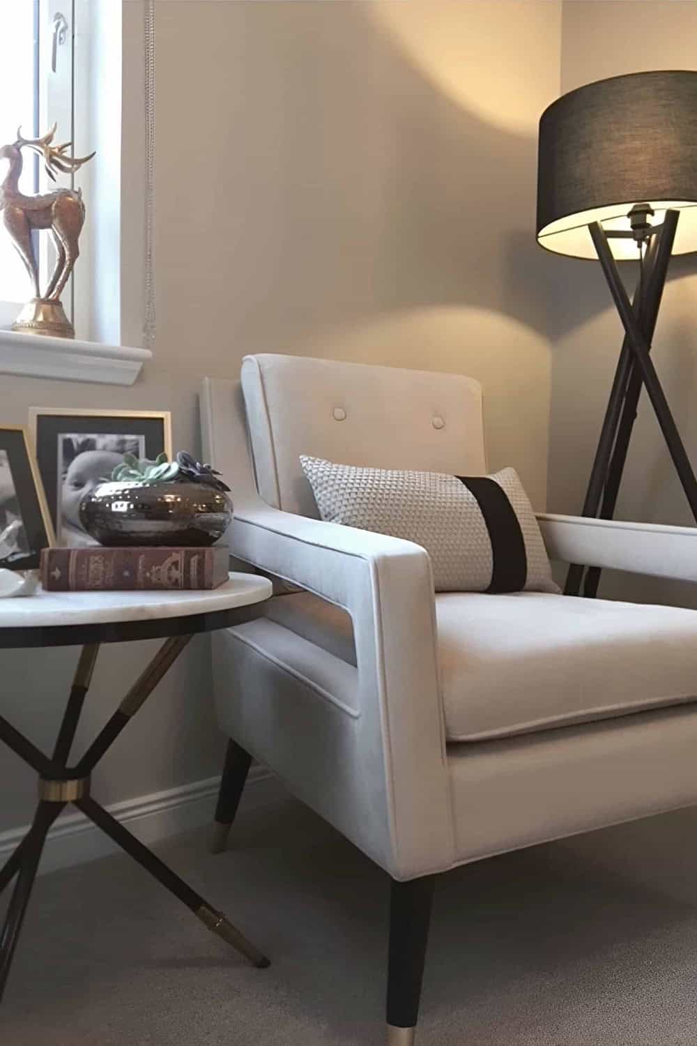 Living room seating vignette with armchair and floor lamp in Lewis Residence Aberdeenshire home interior